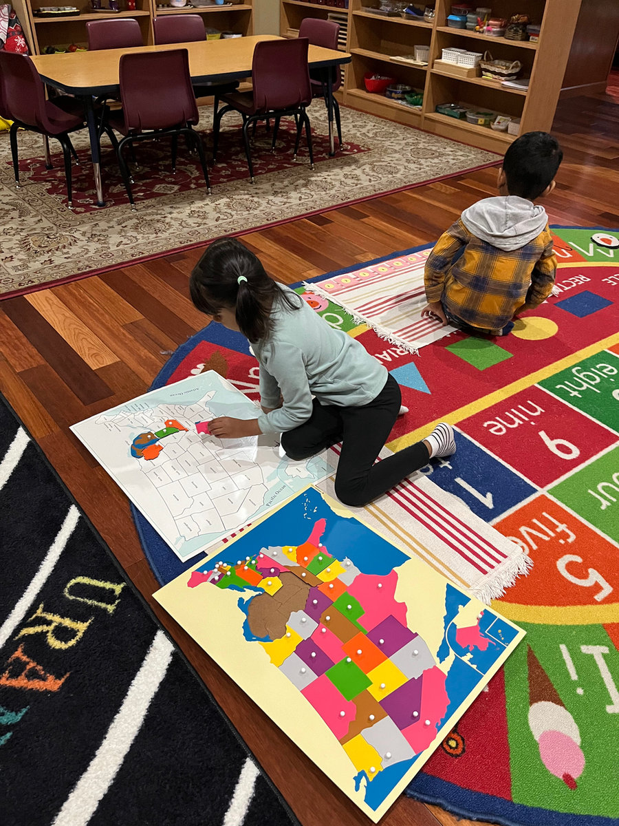 Children engaged with geography materials